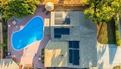 an overhead view of a swimming pool in front of a house at Pool, Hot Tub, Luxury 3 Beds,15 Min Beach,DT, Zoo, Sesame Place, Airport in National City