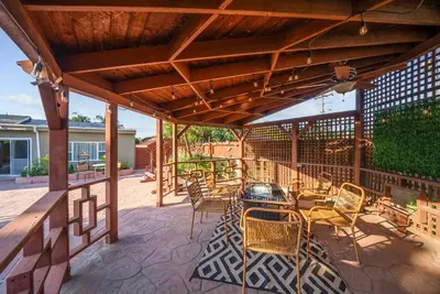 a patio with a table and chairs and a grill at Pool, Hot Tub, Luxury 3 Beds,15 Min Beach,DT, Zoo, Sesame Place, Airport in National City