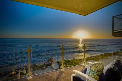 a view of the ocean from a house at Oceanfront Getaway, Private Beach, Fire Pit, 5BR in Oceanside