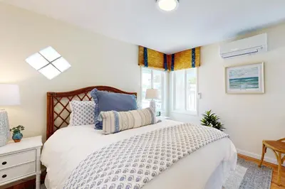 a bedroom with a large bed and a window at Blue Oasis Cozy Home in San Diego