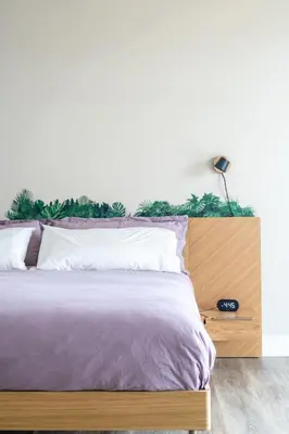 a bedroom with a bed with a wooden headboard at Vista Grande home in Ramona