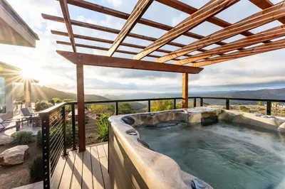 a hot tub on the balcony of a house at Vista Grande home in Ramona