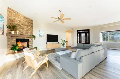 a living room with a couch and a fireplace at Vista Grande home in Ramona