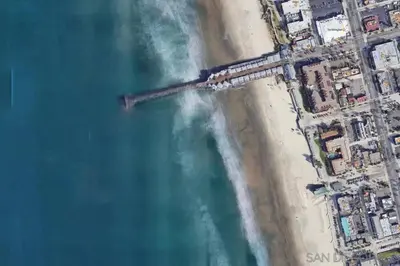 an aerial view of a beach and the ocean at Beach Front Paradise - Entire Condo- Crystal Pier in San Diego