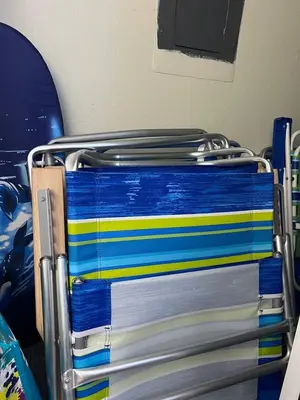 a stack of colorful towels on a rack at Beach Front Paradise - Entire Condo- Crystal Pier in San Diego