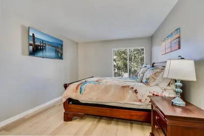 a bedroom with a bed and a window at Pacific Beach Resort Condo - Walk to the Beach in San Diego