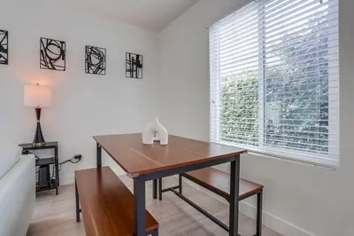 a desk in a room with a large window at A-C 3 Blocks to Ocean Downtown La Jolla Remodel in San Diego