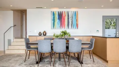 a dining room with a table and chairs at Jewel by AvantStay Panoramic Ocean Views in La Jolla in San Diego