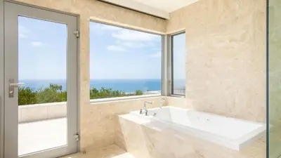 a bathroom with a tub and a large window at Jewel by AvantStay Panoramic Ocean Views in La Jolla in San Diego