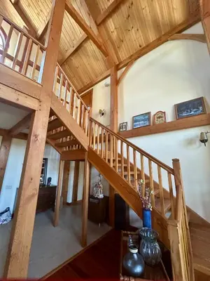 a wooden staircase in a house with wooden ceilings at Sunset-Ridge in Alpine