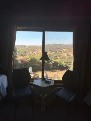 a room with a window with a table and a view at Sunset-Ridge in Alpine