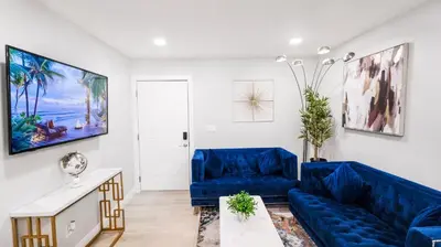 a living room with blue furniture and a blue couch at Xlnc Home 3bed2bath by sdstay in Lemon Grove
