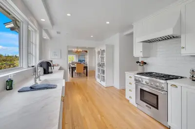 a kitchen with white counters and a stove top oven at Luxury Ocean View Retreat in San Diego