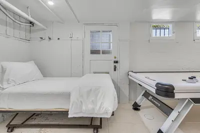 a hospital room with a bed and a table at Luxury Ocean View Retreat in San Diego
