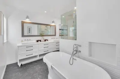 a white bathroom with a tub and a sink at Luxury Ocean View Retreat in San Diego