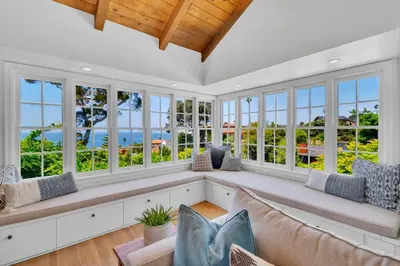 a large living room with a couch and windows at Luxury Ocean View Retreat in San Diego