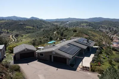 an overhead view of a house with solar panels on it at Lakeside Hilltop Retreat with Amazing Pool and Spa in Lakeside