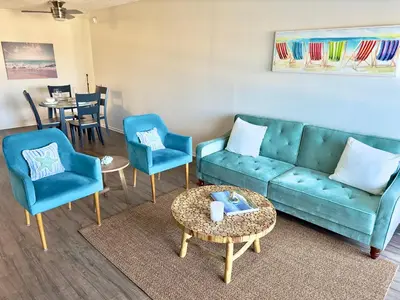 a living room with a couch and chairs and a table at Cozy Coastal Retreat Newport Beach in Newport Beach