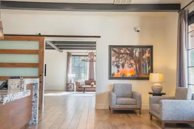 a living room with chairs and a painting on the wall at Diamond Riviera Oaks Resort and Racquet Club 1BD in Ramona