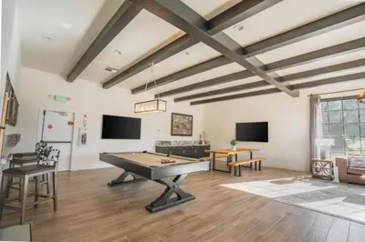 a living room with a ping pong table at Diamond Riviera Oaks Resort and Racquet Club 2BD in Ramona