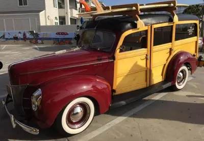 an old red and yellow van parked in a parking lot at Diamond - Riviera Beach and Spa Resort 1bd in Dana Point