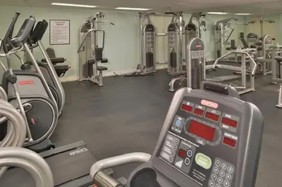 a gym with several treadmills and cardio machines at Diamond - Riviera Beach and Spa Resort 2bd in Dana Point