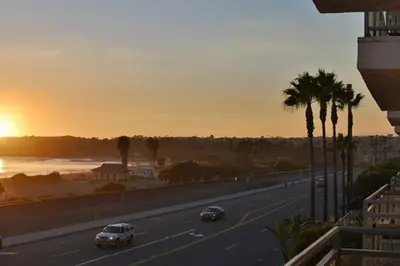 a highway with cars driving down a road with palm trees at Diamond - Riviera Beach and Spa Resort 2bd in Dana Point