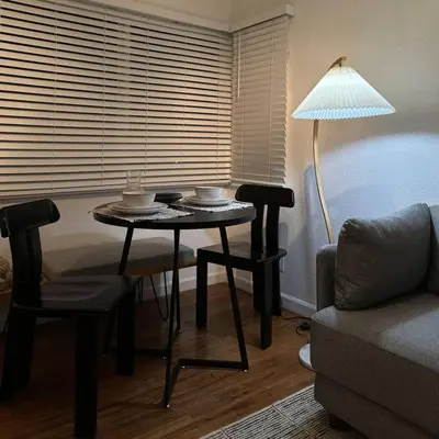 a living room with a table and a couch at Modern Eclectic 1BR by Downtown, Airport & More in San Diego