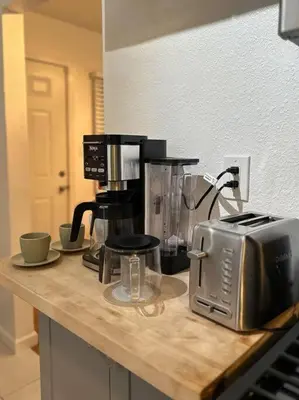a kitchen counter with a coffee maker and a toaster at Modern Eclectic 1BR by Downtown, Airport & More in San Diego