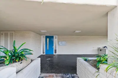 a front door of a building with plants at Jewel of La Jolla in San Diego