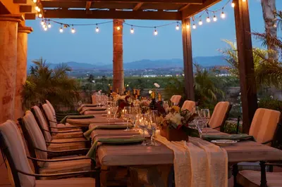a long table in a room with a view at Carter Estate Winery and Resort in Temecula