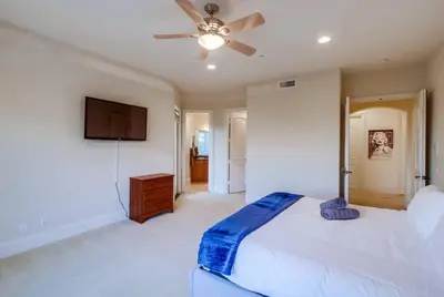 a bedroom with a bed and a ceiling fan at Villa Andalusia 6BR 5BA Luxury Jacuzzi Views and Games in Escondido