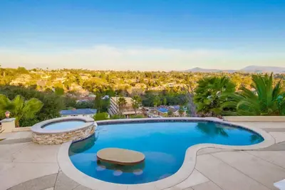 a swimming pool with a view of a city at Villa Andalusia 6BR 5BA Luxury Jacuzzi Views and Games in Escondido