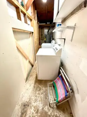 a small bathroom with a sink and adirty floor at The Downtown Blue Bungalow Escape in San Diego