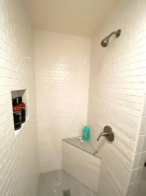 a white bathroom with a sink and a shower at The Downtown Blue Bungalow Escape in San Diego