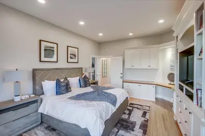 a bedroom with a large bed in a room at Ultimate Getaway: Spa Game Rooms Firepit Views in San Diego