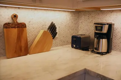a kitchen counter with two knives and a coffee maker at La Jolla Beach Villa Gem in San Diego