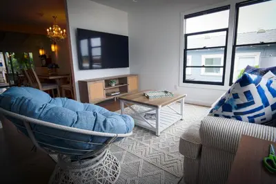 a living room with a couch and a table at La Jolla Beach Villa Gem in San Diego