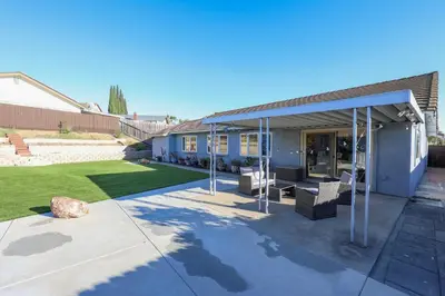 a house with a patio and a yard at Pristine Poway Retreat in Poway