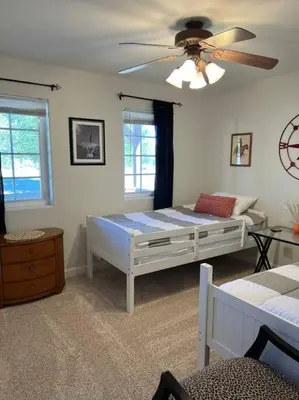 a bedroom with a bed and a ceiling fan at Stylish Country Home with Hot Tub and Amazing Views on 40 Acres in Ranchita