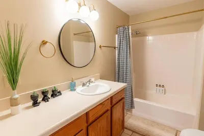 a bathroom with a sink and a mirror at Stylish Country Cowboy Home with Hot Tub on 20 Acres in Borrego Springs