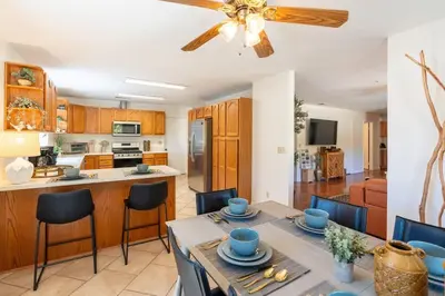 a kitchen and dining room with a table and chairs at Stylish Country Cowboy Home with Hot Tub on 20 Acres in Borrego Springs