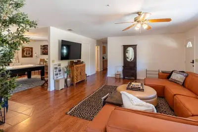 a living room with a couch and a table at Stylish Country Cowboy Home with Hot Tub on 20 Acres in Borrego Springs