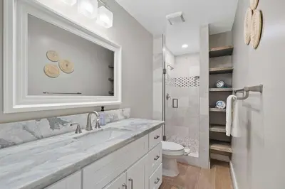 a white bathroom with a sink and a toilet at Endless Summer Beach Studio - Beach - AC - Shops in San Diego