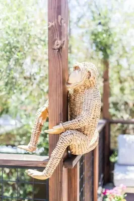a statue of a snake sitting on a wooden post at Little Italy 3BD Home with Huge Patio & Backyard in San Diego