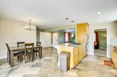 a kitchen and dining room with a table and chairs at Poway Retreat with Stunning Sunset and Mountain Views! in Poway