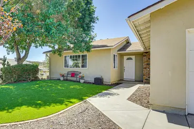 a house with a yard with a lawn at Poway Retreat with Stunning Sunset and Mountain Views! in Poway