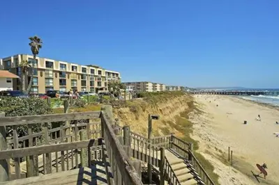 a view of a beach with a building and a building at Ocean Breeze 2 bedroom in San Diego