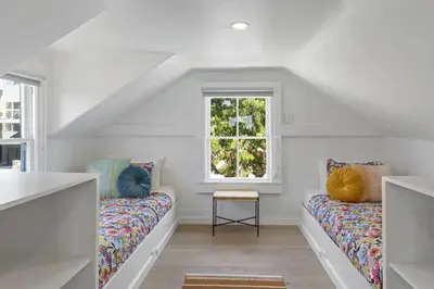a white room with two couches and a window at 5BD Home with outdoor space in Little Italy in San Diego