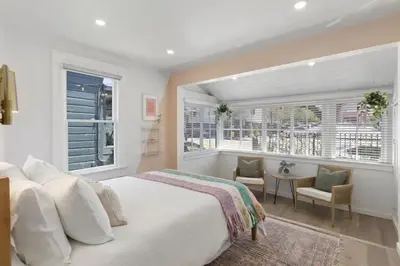 a bedroom with a bed and a window and a table at 5BD Home with outdoor space in Little Italy in San Diego